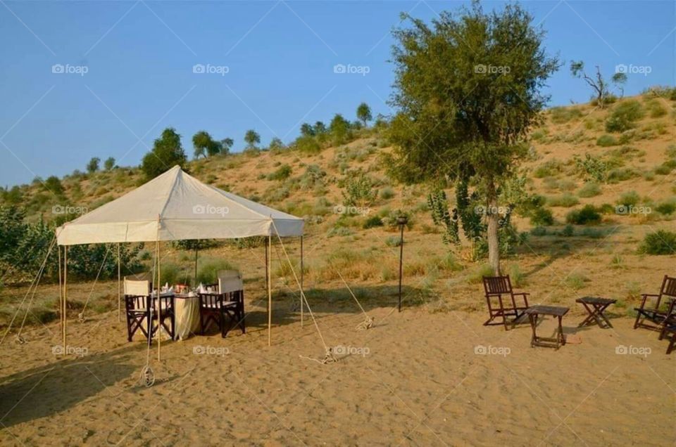 It's  a nice and comfortable place  and chairs kept on the sand