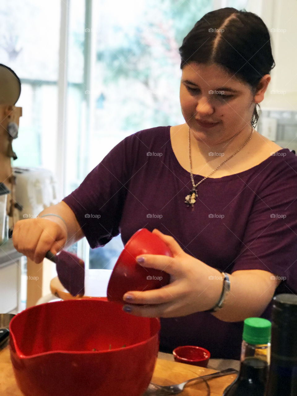 My daughter the master chef making her family a meal of homemade wonton soup. She learned to make it at school in her Global Foods course and it was fun to watch her make if from scratch for us!!! Yummy!