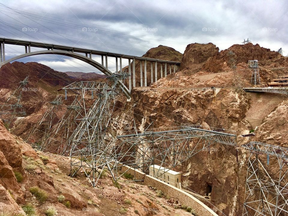 Weird steel construction at Hoover Dam, with a bridge off in the distance. 