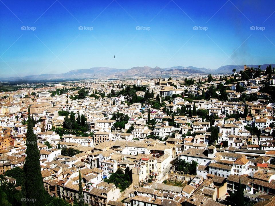 Look out over the white washed city of Granada from the beautiful Alhambra Palace