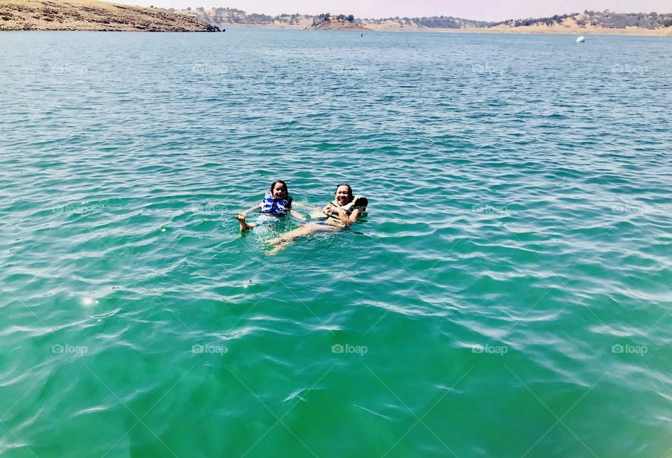 Floating with our vests at Don Pedro Lake