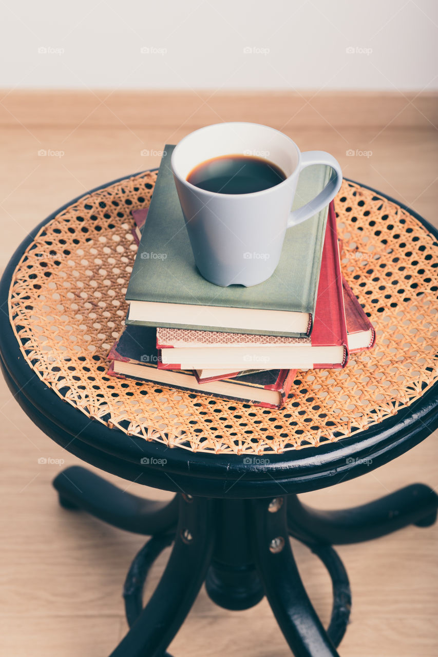 A few books with cup of coffee and cookies on wooden floor. Time for relax. Spending leisure time on reading. Cozy and comfortable. Learning from books 📖Studying for the next exam 😌