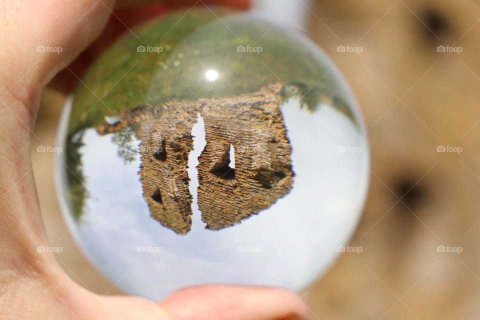 Ruined tower through glass ball