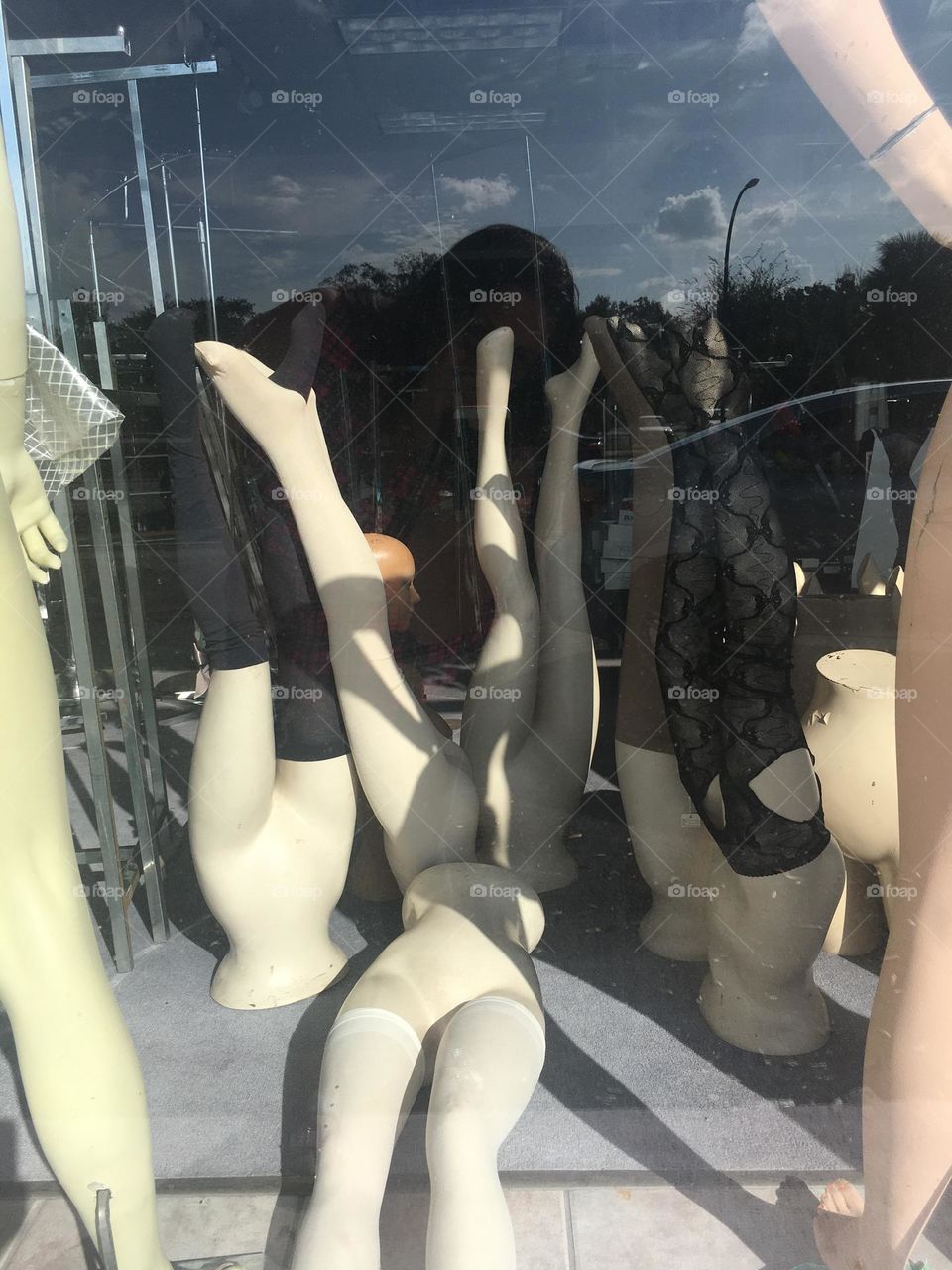 Mannequins in a abandoned store window 