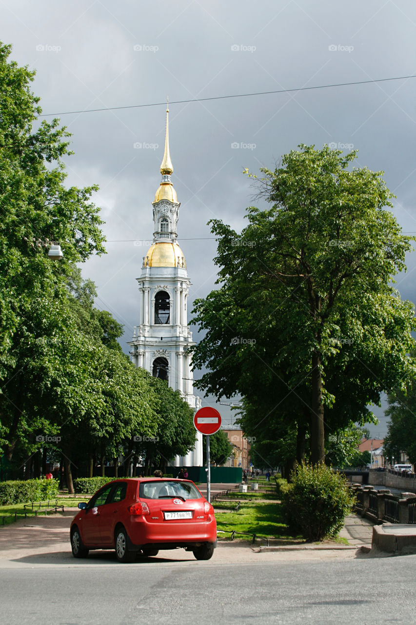 Church and red car