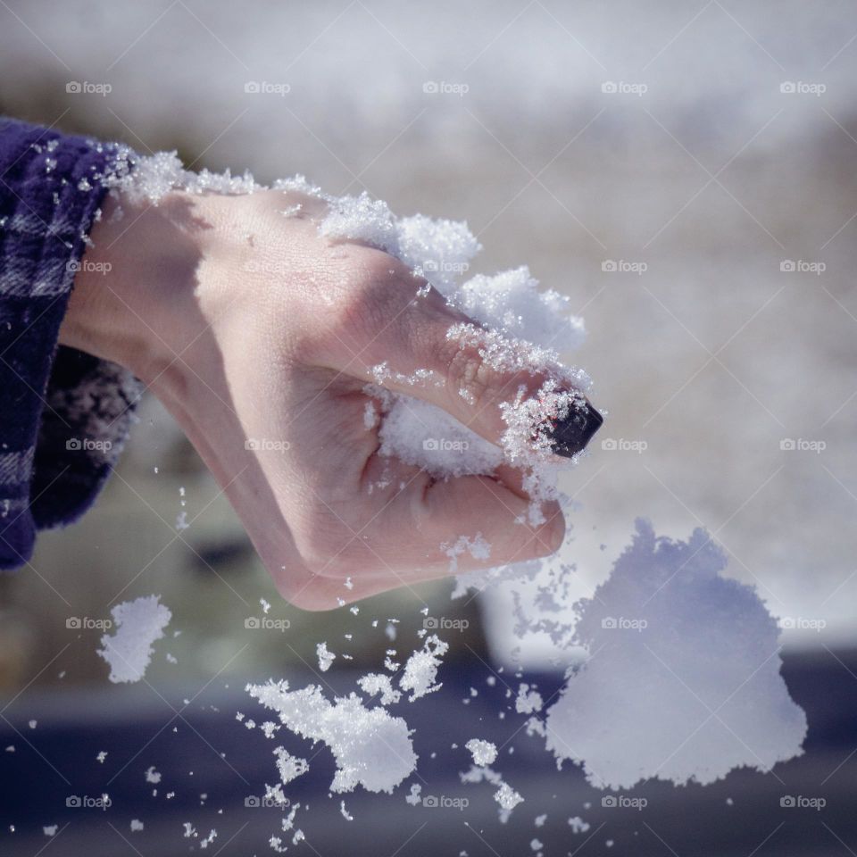 Snow being crushed by hand