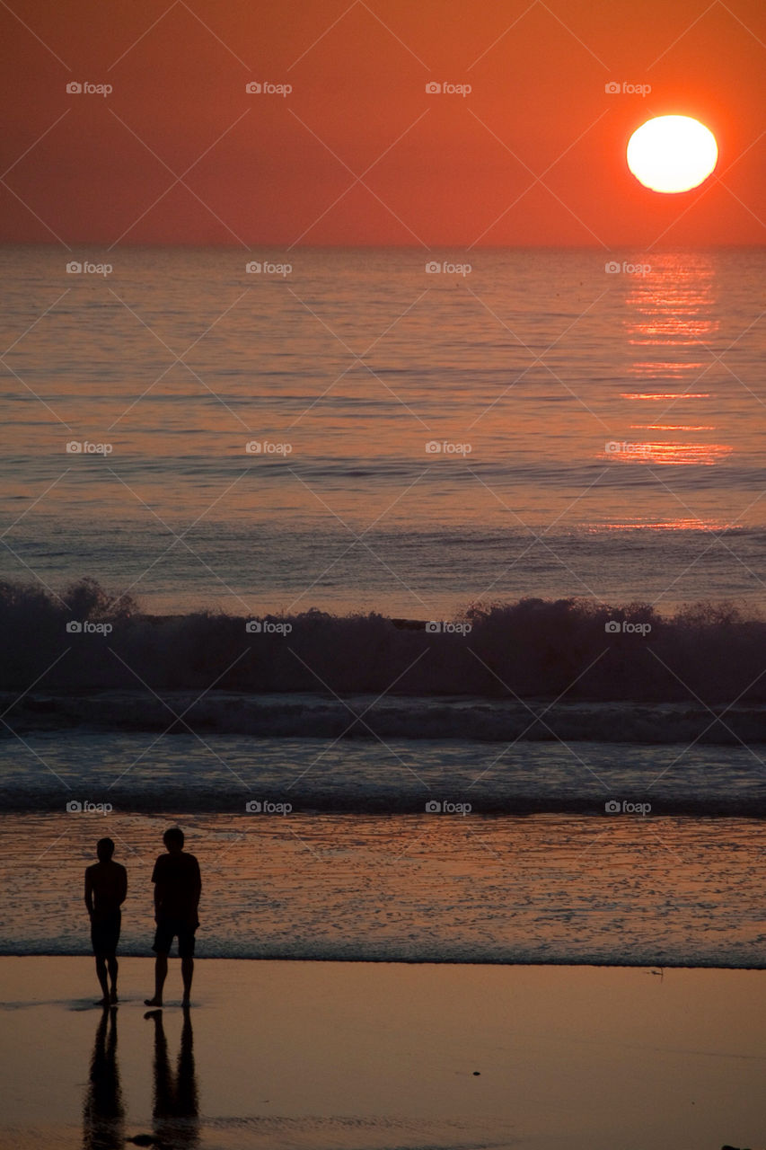 Couple on the beach at sunset California