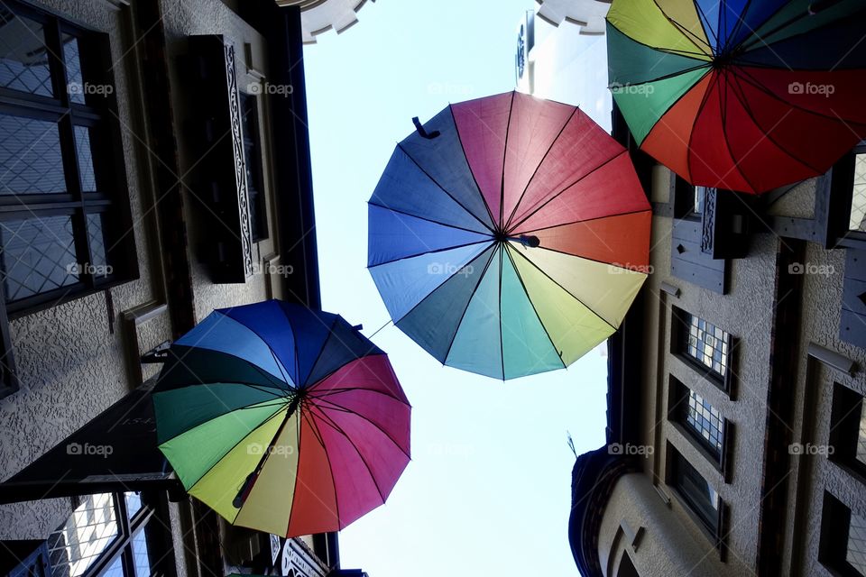 Colourful umbrellas are shown in shopping arcade called London Court, Perth, Western Australia.