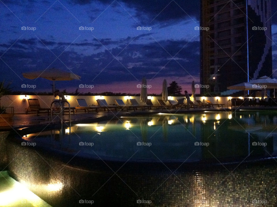 sunset swimming pool radisson by nader_esk
