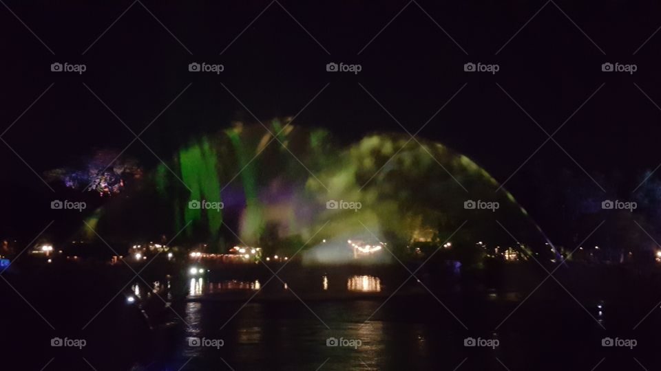 The colors reach high into the sky above Discovery River during Rivers of Light at Animal Kingdom at the Walt Disney World Resort in Orlando, Florida.