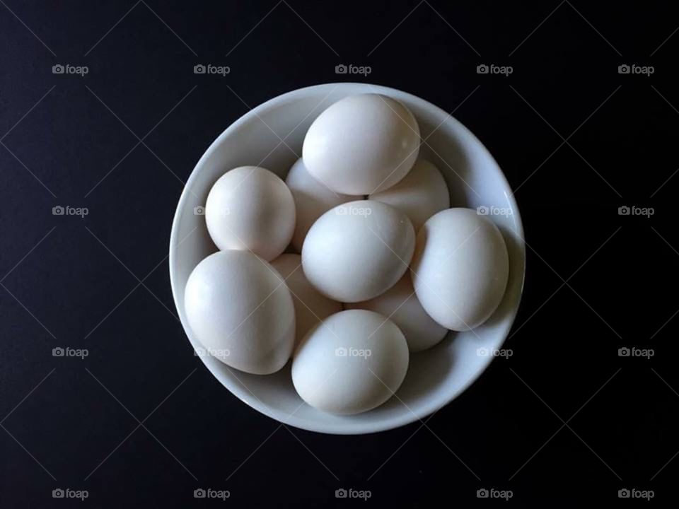 Eggs In White Bowl on Black