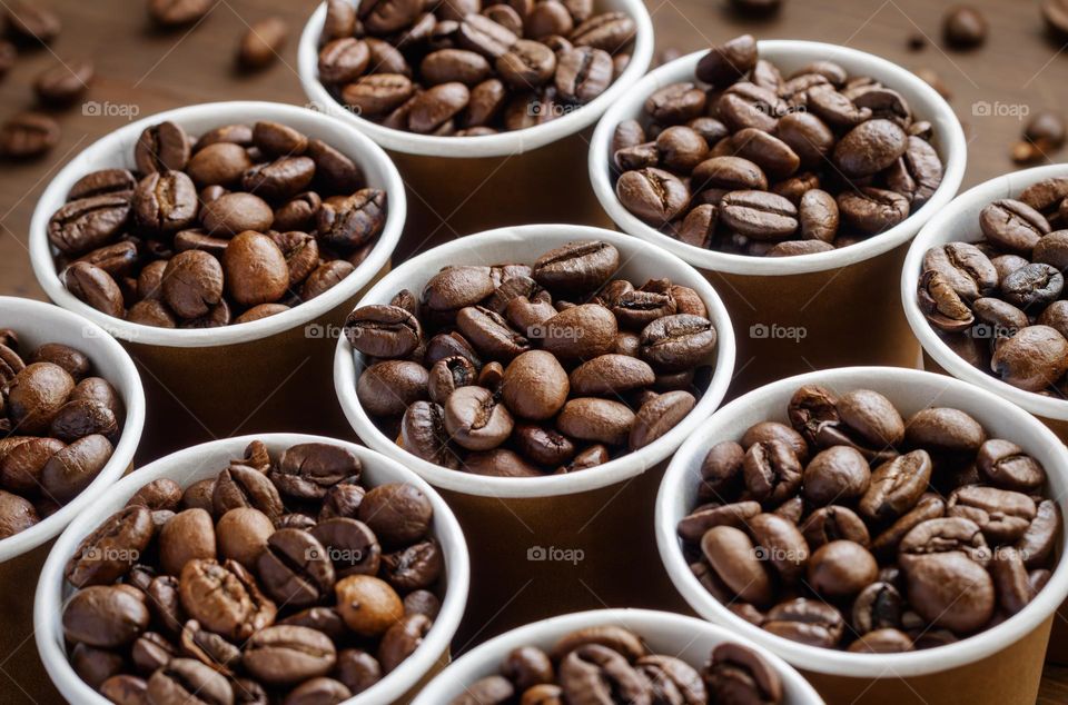 Small pots of coffee beans