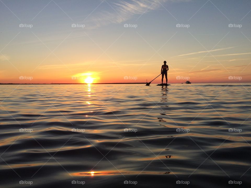 An evening paddle boarding session at the Bay