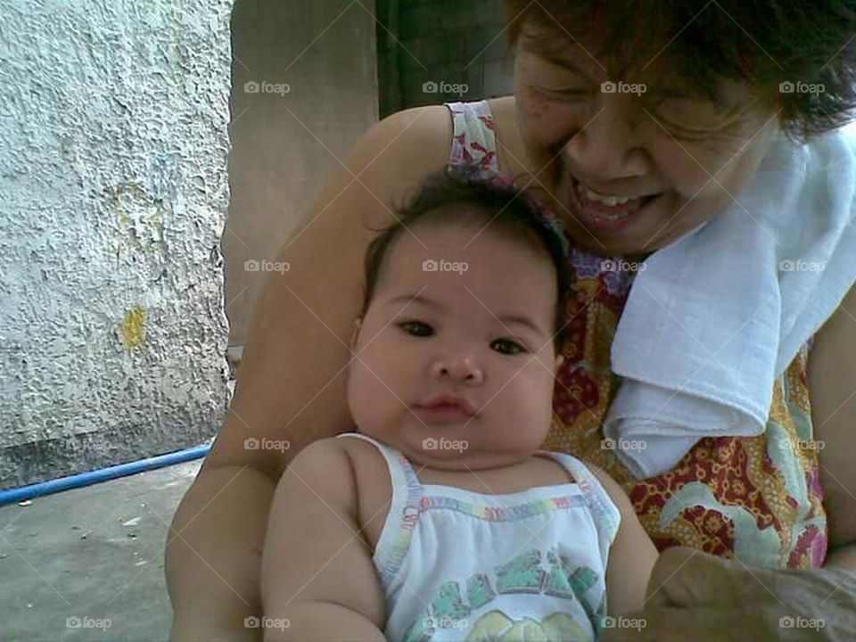 Cute baby and grandmother