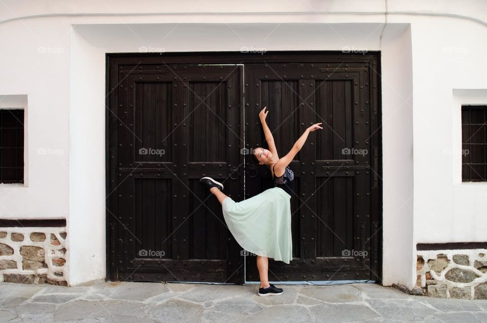 Young Female Ballerina Dancing Outside