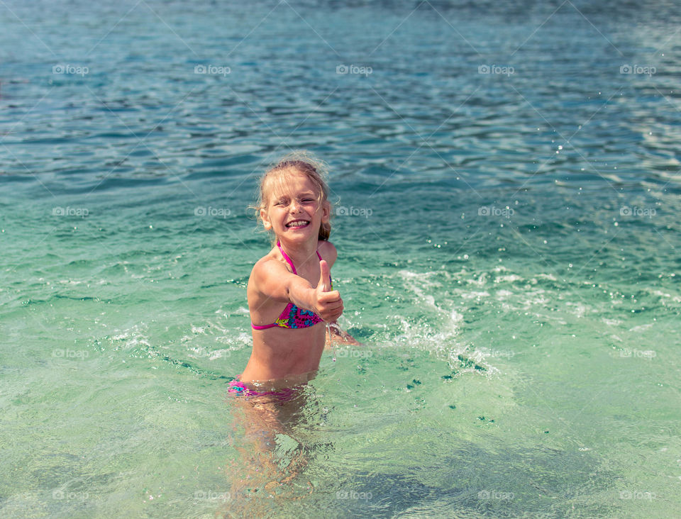 girl is enjoying summer and the sea