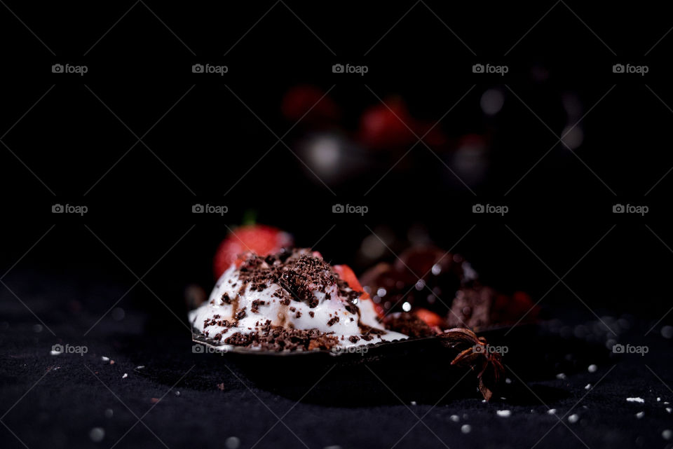 Ice cream with chocolate and strawberries