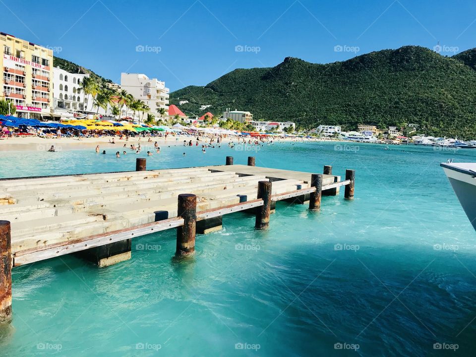 Gorgeous photo of St. Martin’s beach side area full of people and fun shops to explore! 