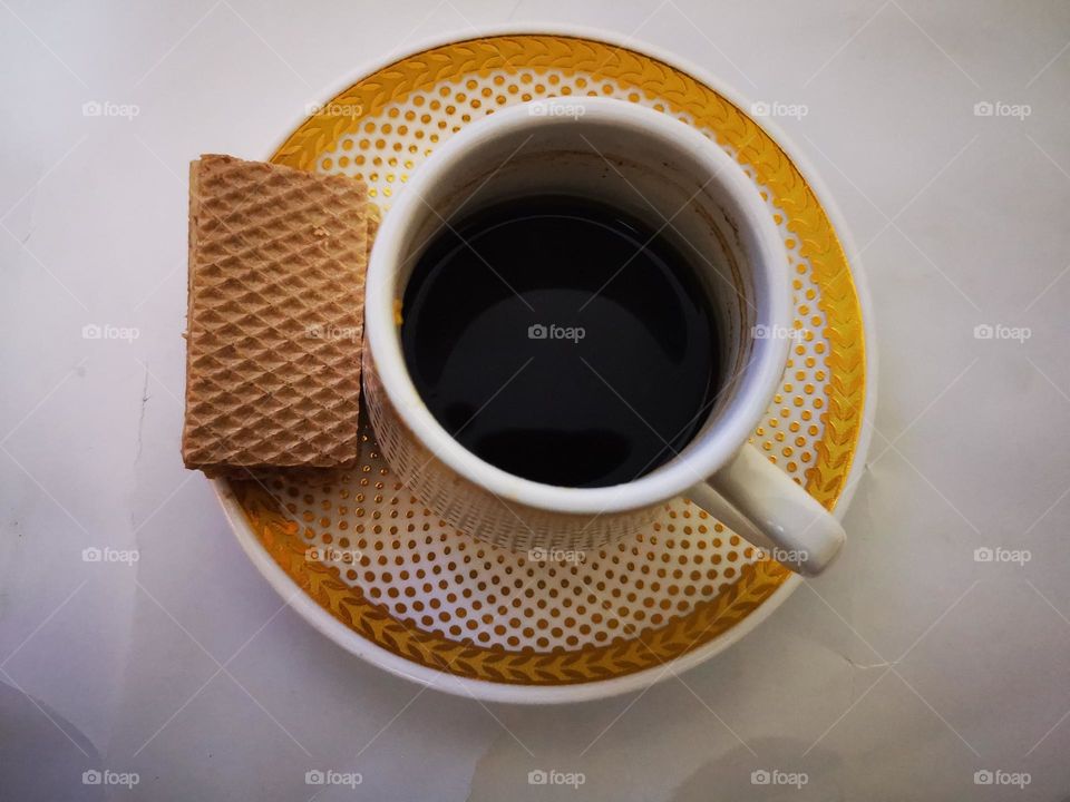 Coffee cup with biscuits