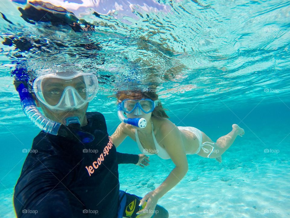 Couple enjoying Snorkeling underwater