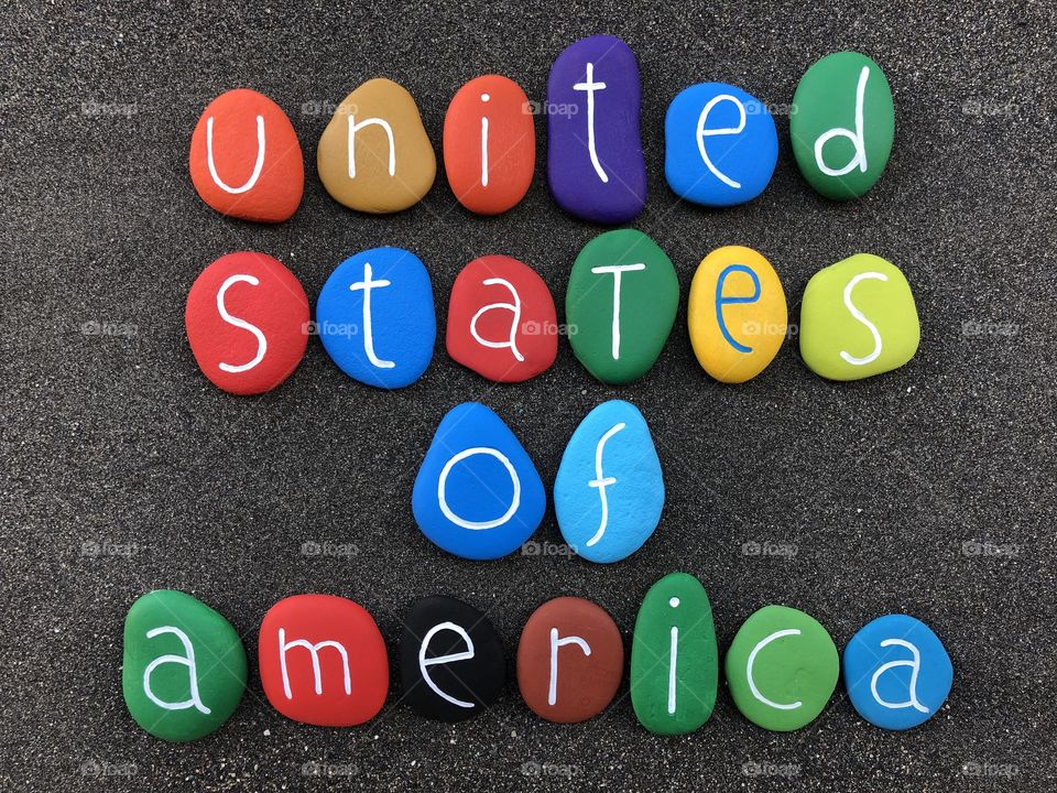 United States of America, souvenir with multicolored stones over black volcanic sand