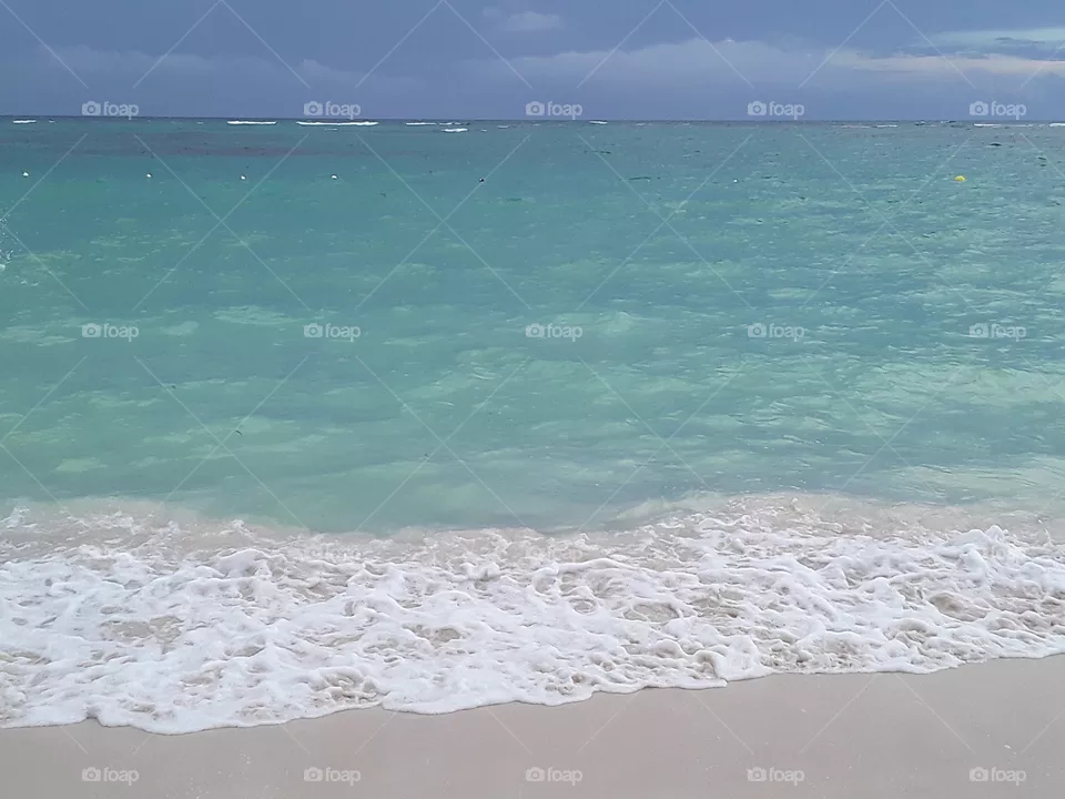 sky, ocean and corral sand