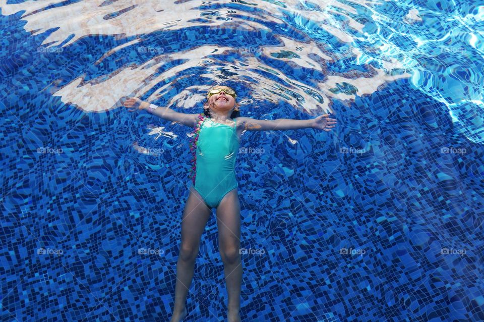 High angle view of girl in swimming pool;