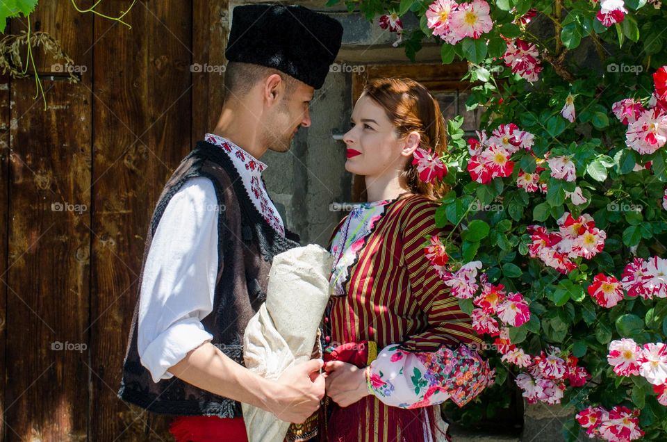 Tenderness Series:Beautiful Happy Couple Young Husband Wife, Dressed in Bulgarian Traditional Clothing (nosiya)