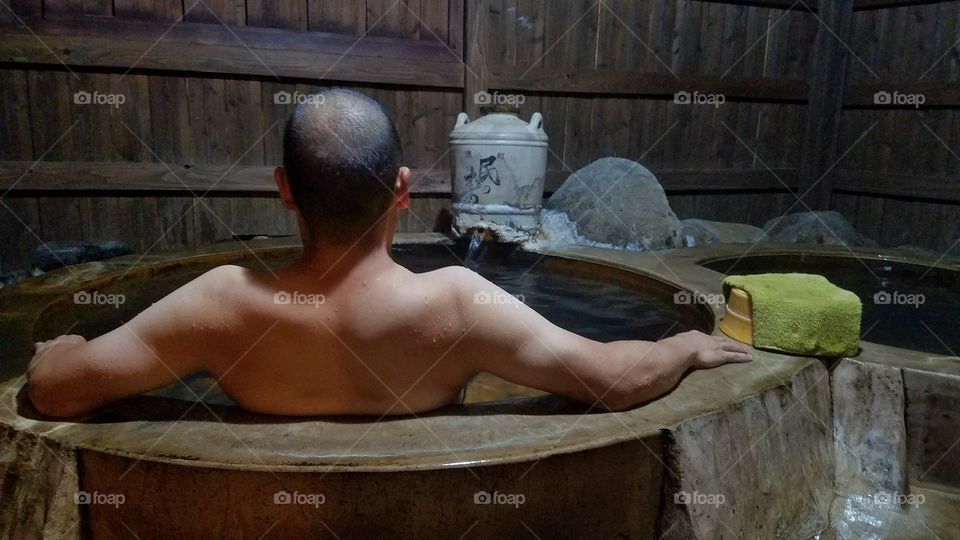 Soaking in the hot spring tub