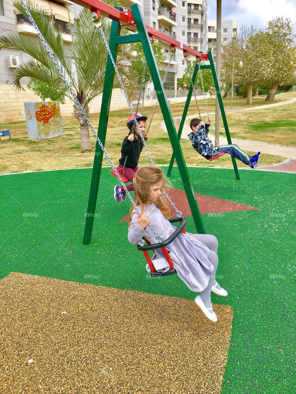 Children playing on swings