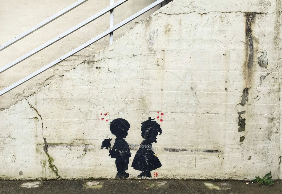 Banksy like artwork at the bottom of some steps …