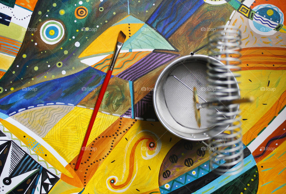 Artistic, a paintbrush and a paintbrush holder on a colorful background 1