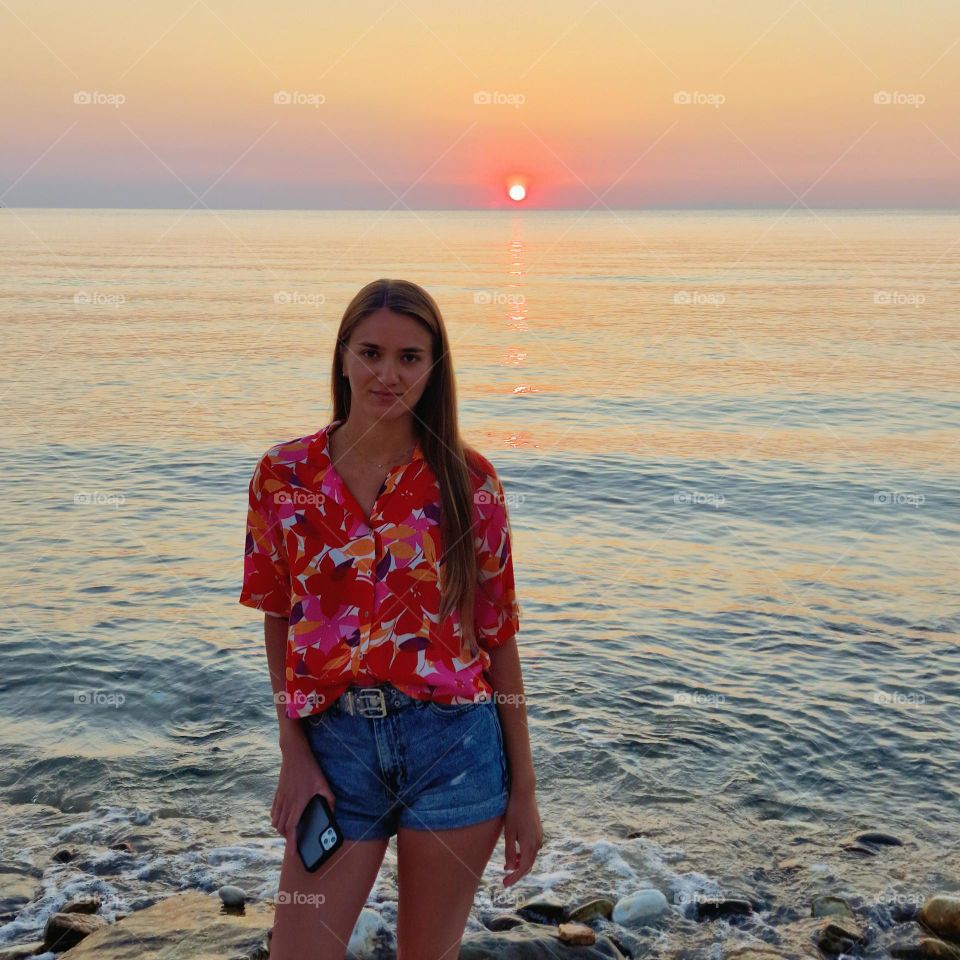 the beautiful girl in the magenta shirt at sunrise