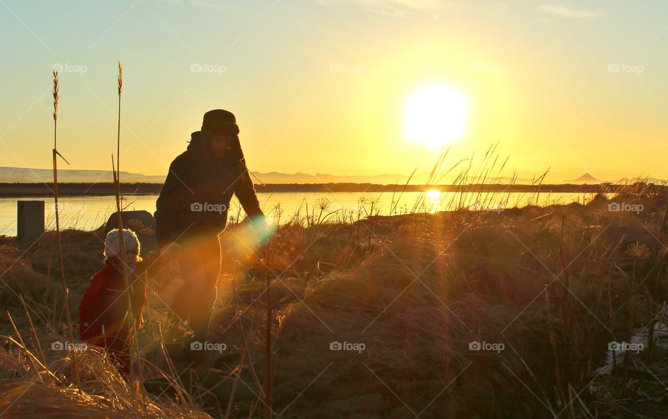 Iceland sunset. father and daughter