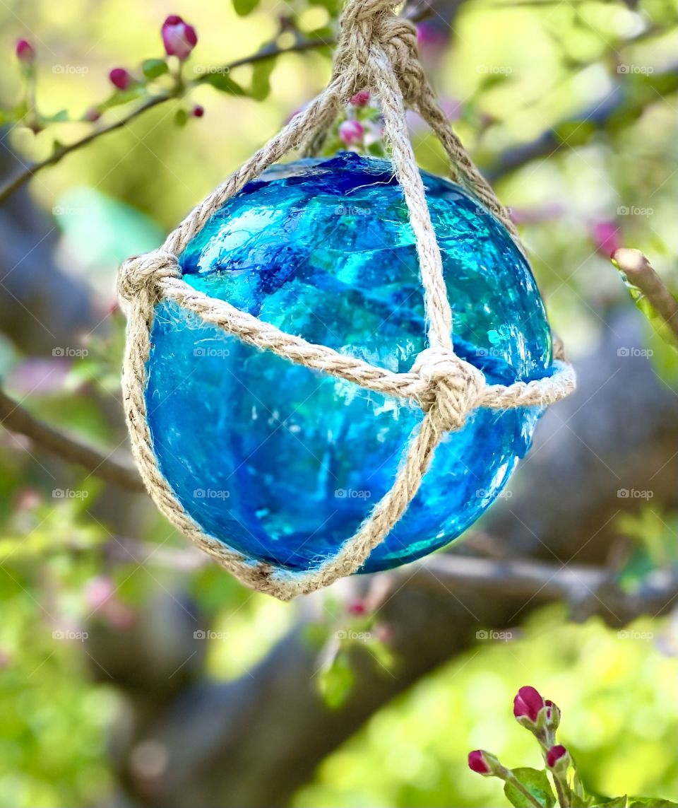 Blue glass ball with rope