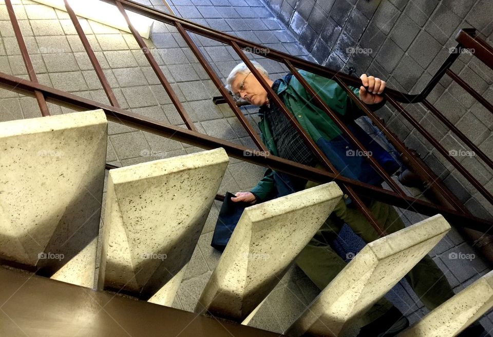 Senior man climbing stairs