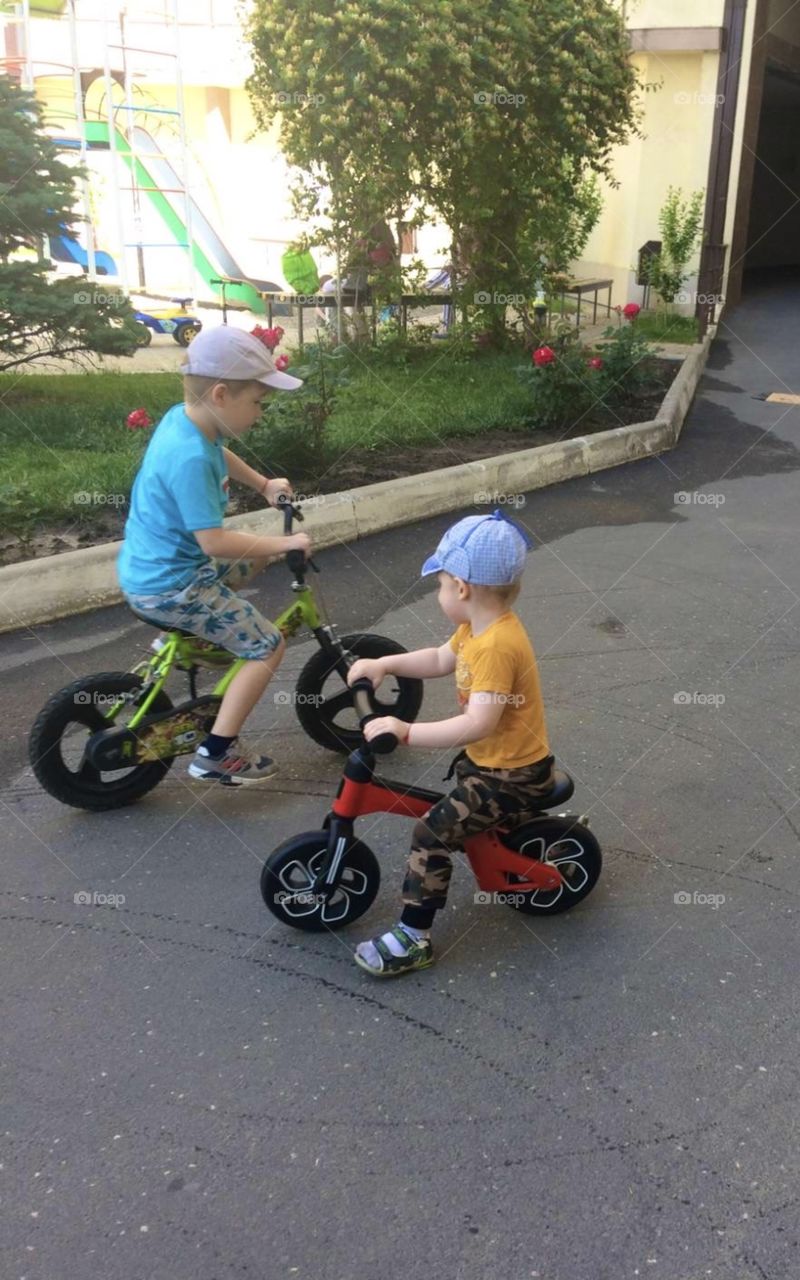 Two brothers on the bicycles 