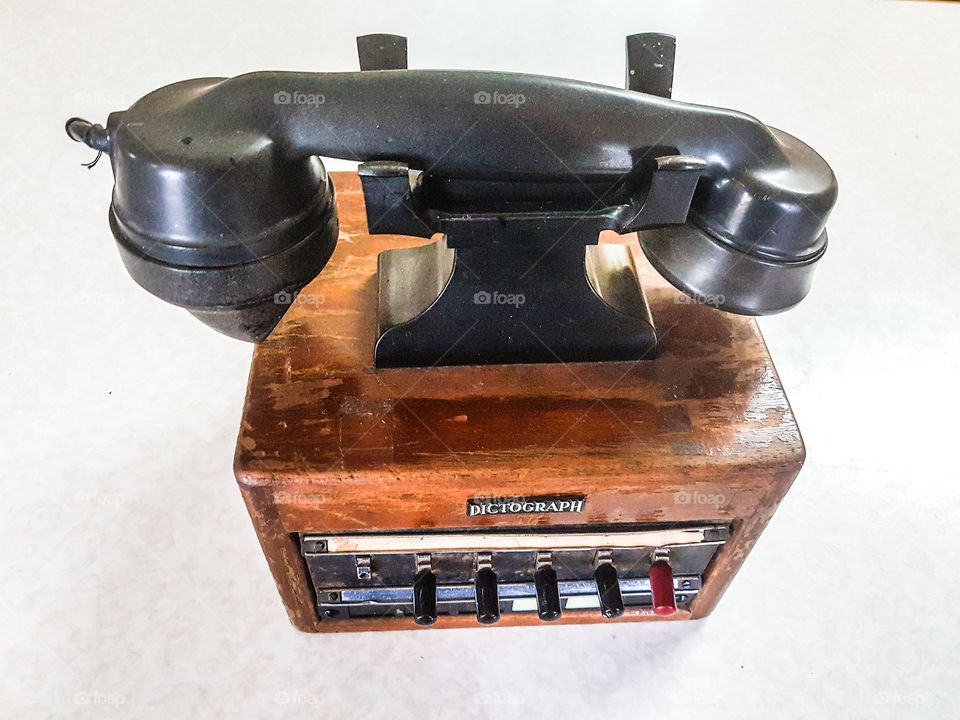 Old style switchboard phone on wooden box