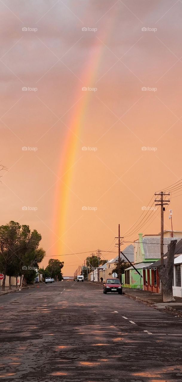 Destination at the end of the rainbow. driving through the small-town of Frazerburg in the karoo South Africa.