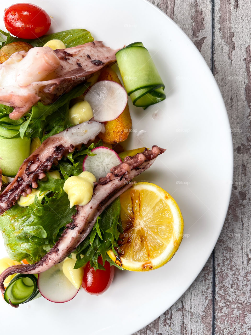 Salad with calamari legs and potatoes