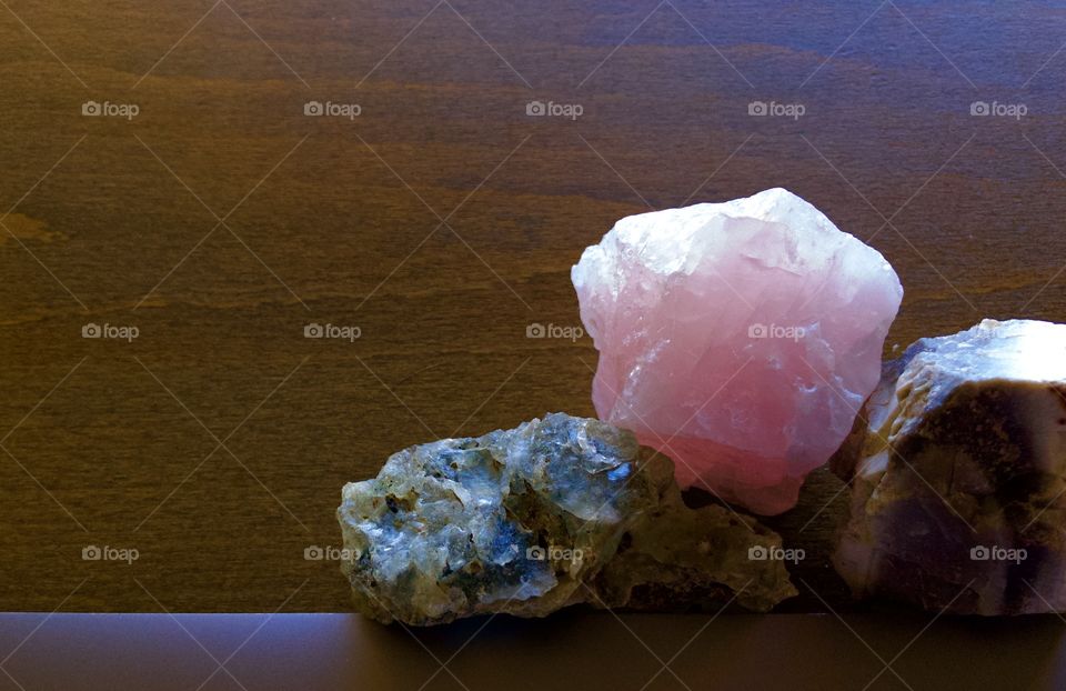 Rose quartz on wooden desk 🪵