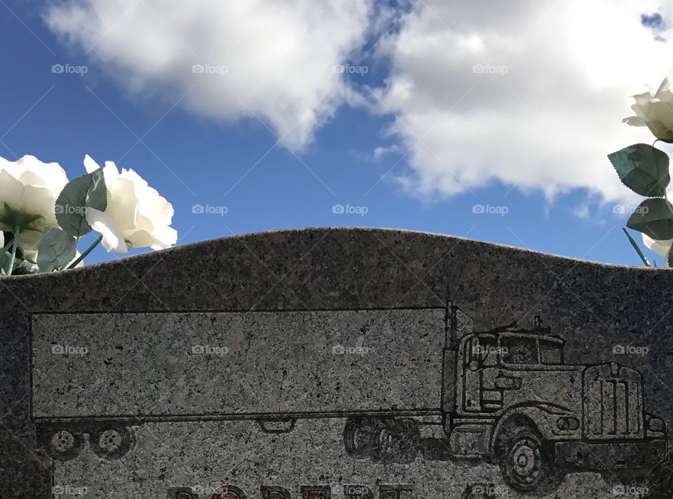 Semi tractor trailer engraved on a headstone at a cemetery 