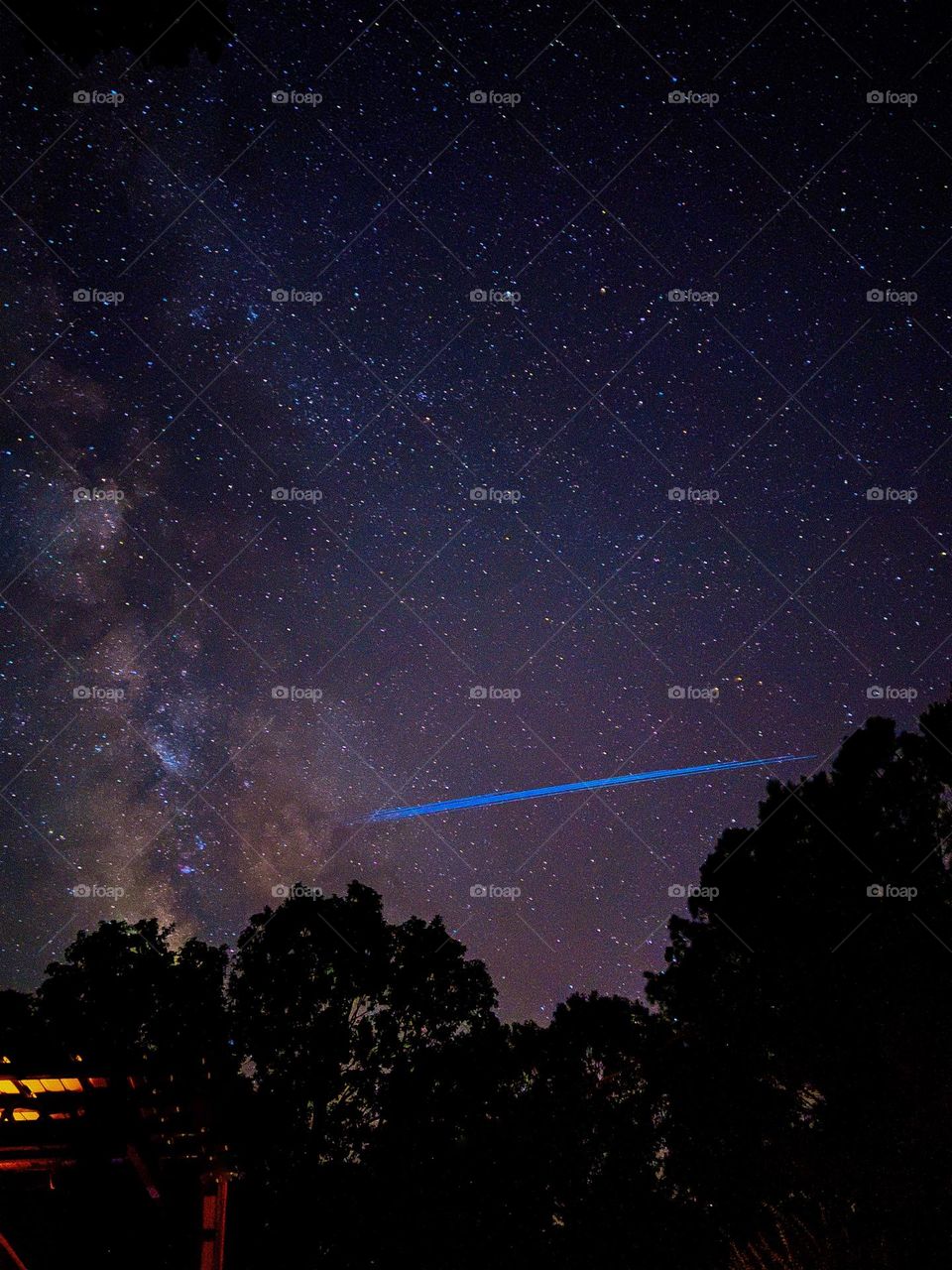 This is a long exposure of a Starlink train that had launched just a couple of days before. I caught it just as it was about to cross the Milky Way Galaxy.