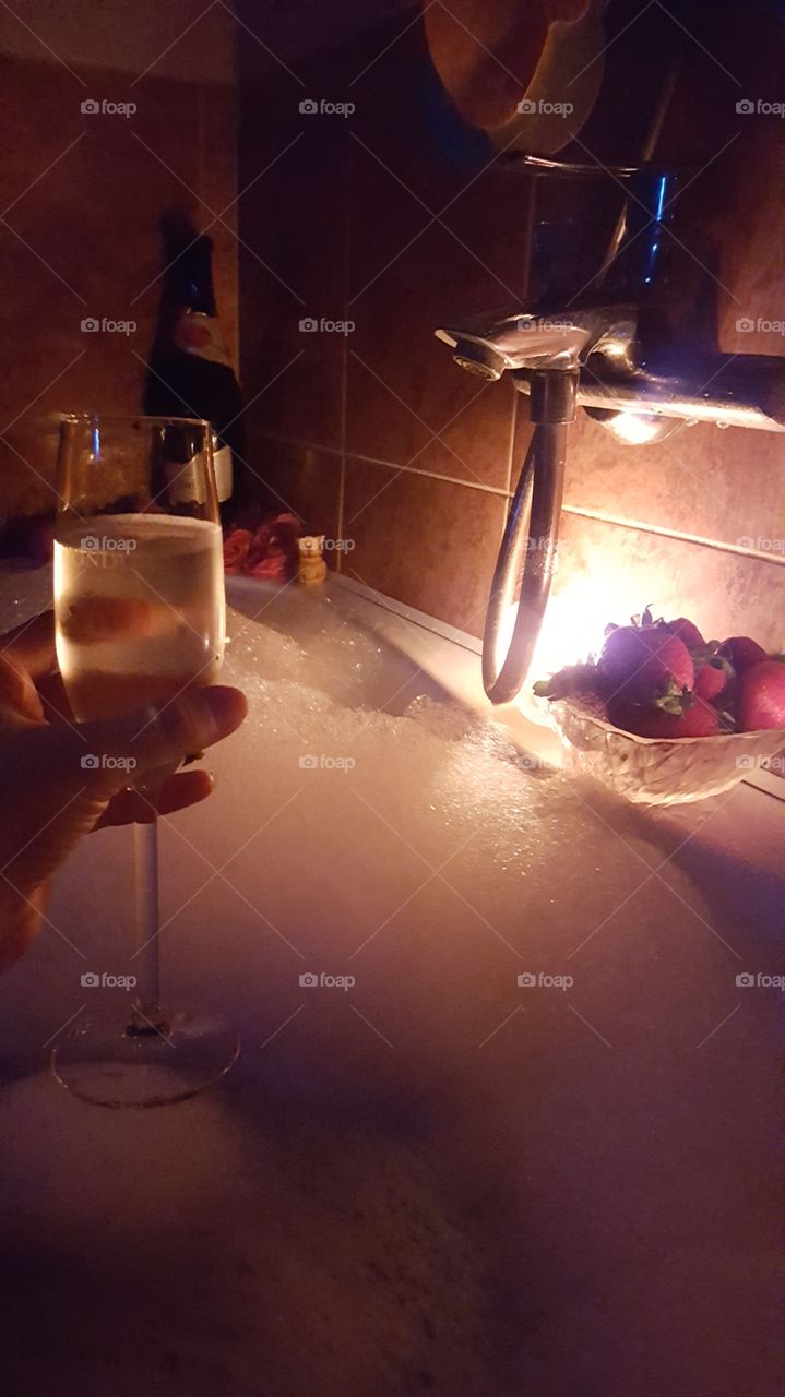 Romantic evening, dinner, champagne, strawberry, fruit, bath