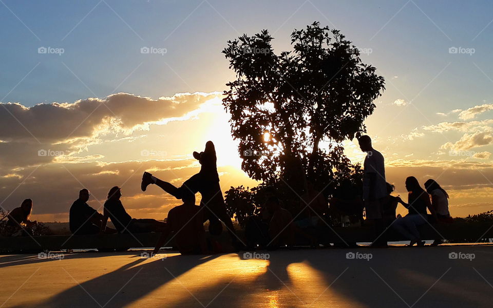 capoeira. dancing capoeira in brasilia at sunset