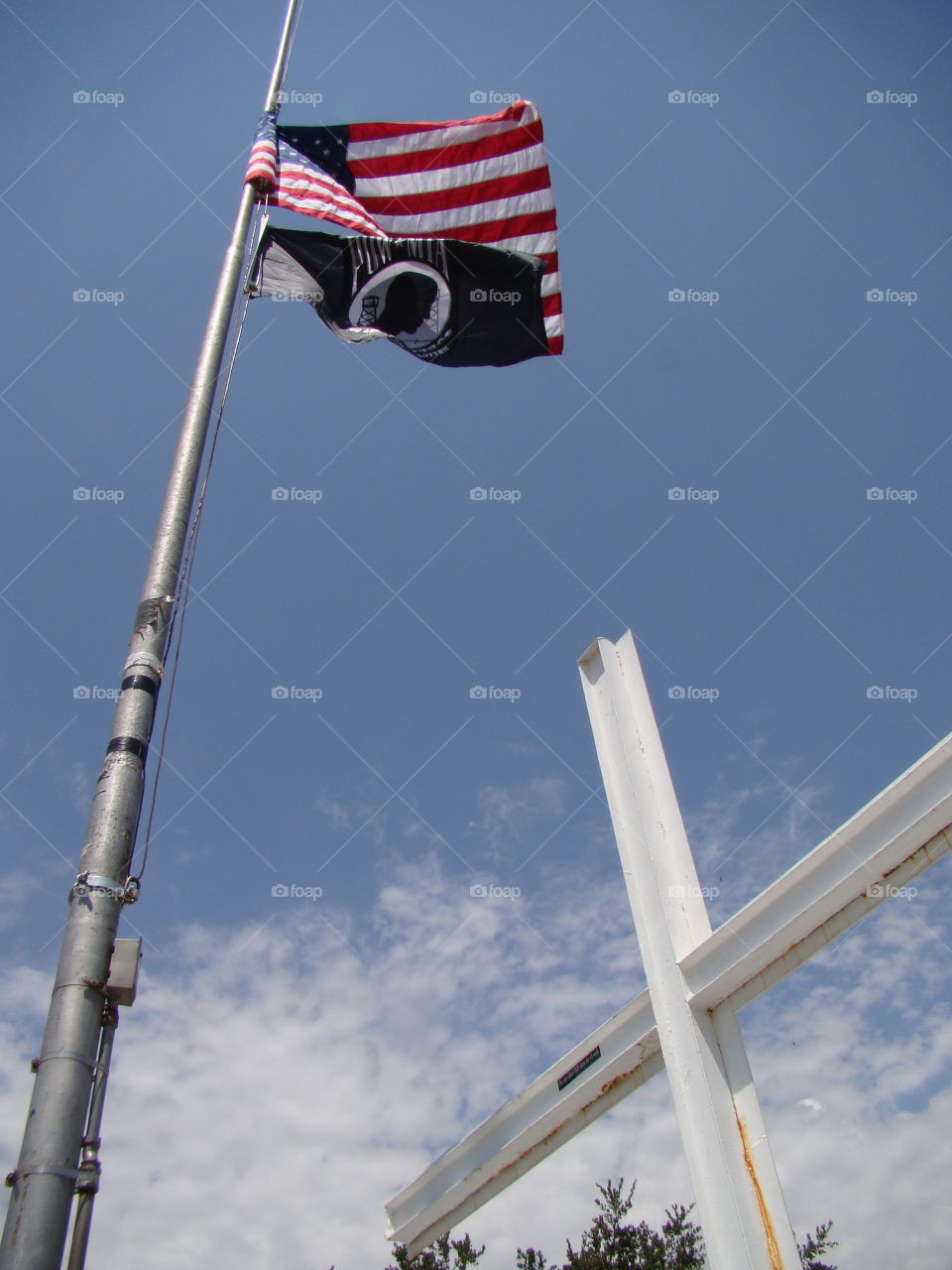 Flags and back of the cross