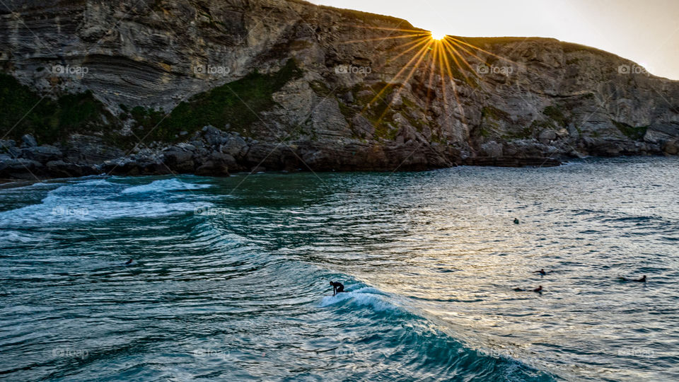 Surfing at Cantabria, Spain on sunset 