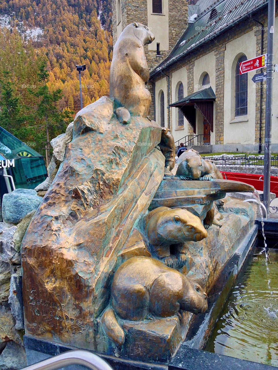 marmot fountain in bronze zermatt by swisstraveler