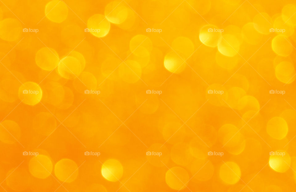 Gold yellow orange bokeh background.