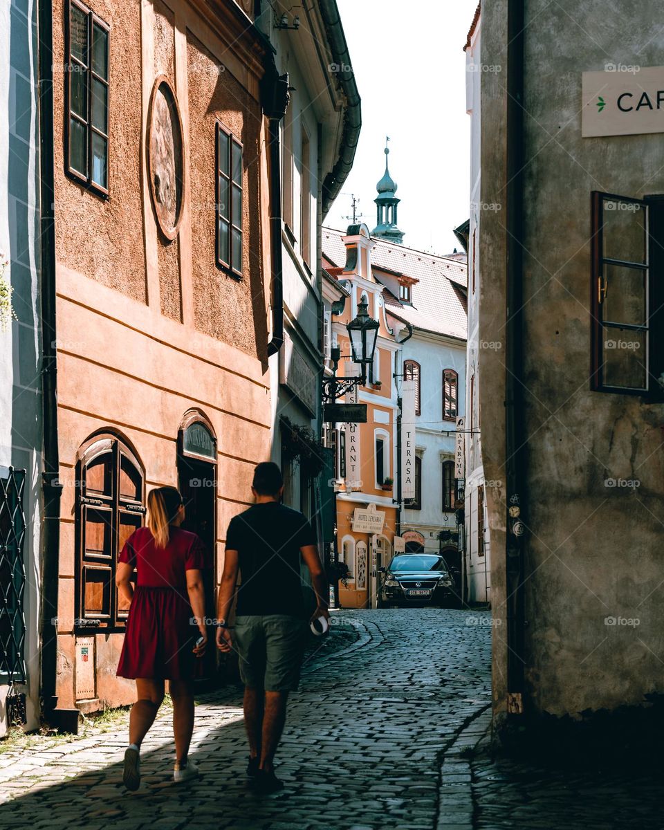 A couple walking the old streets of Cesky Krumlov 